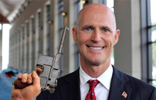 Governor Scott demonstrates new law.