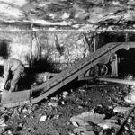 Photo of two men in a coal mine